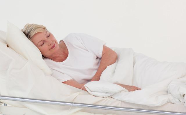 elderly patient lying in bed